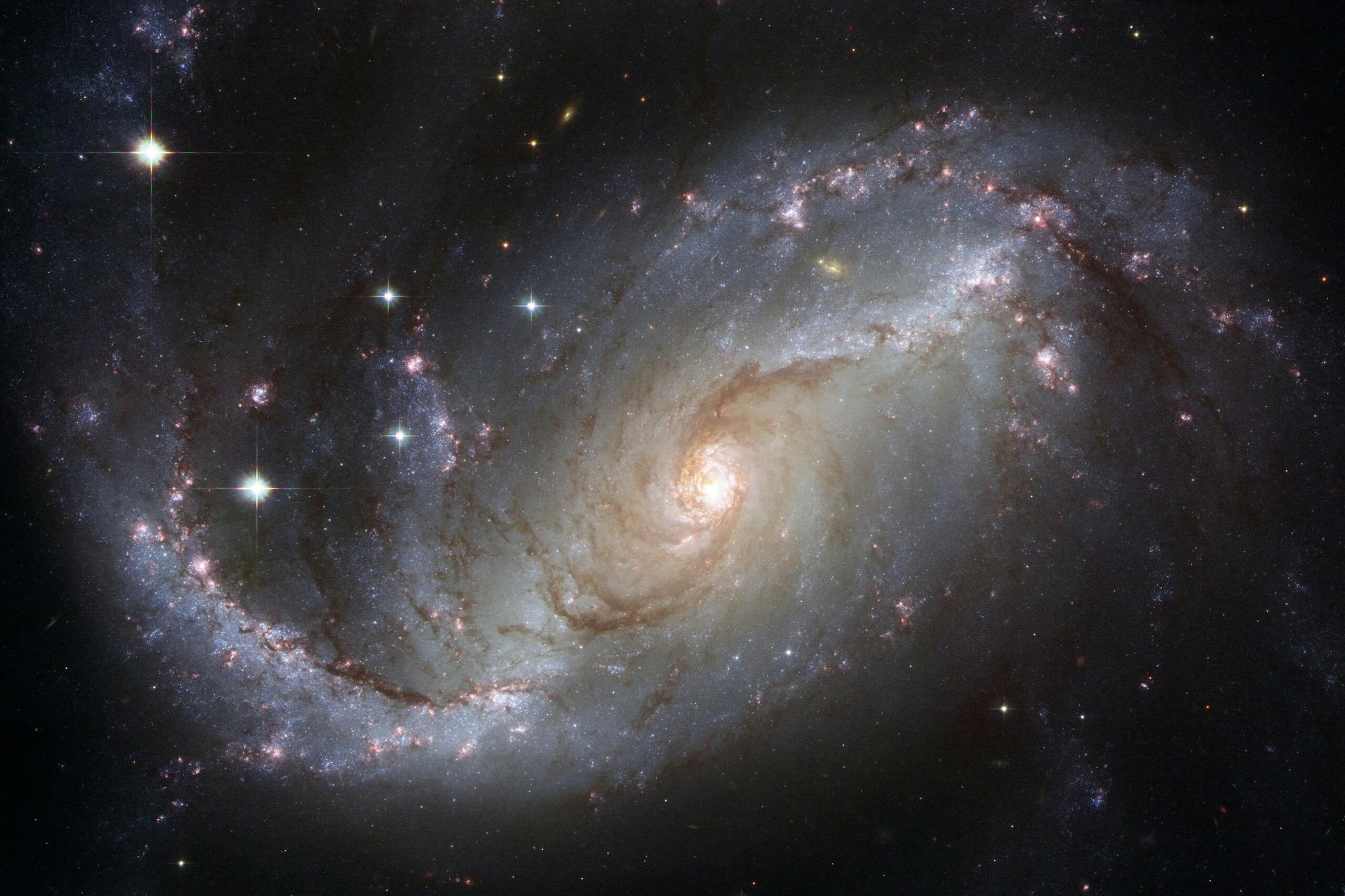 Capture of the NGC 1672 spiral galaxy showcasing its majestic spiral arms and bright core.